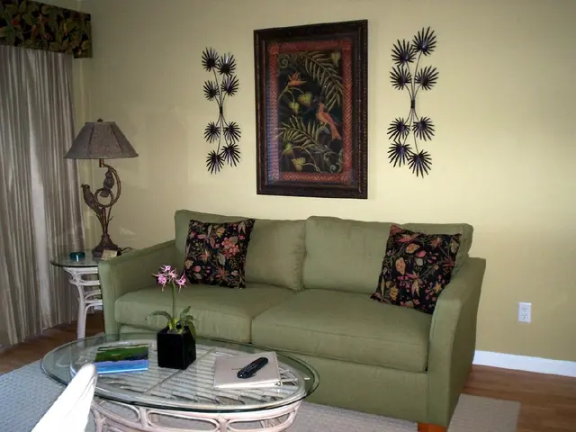 Designers opting for deep, earthy green in 2026, as demonstrated by Cliff Richard's green sofa,...