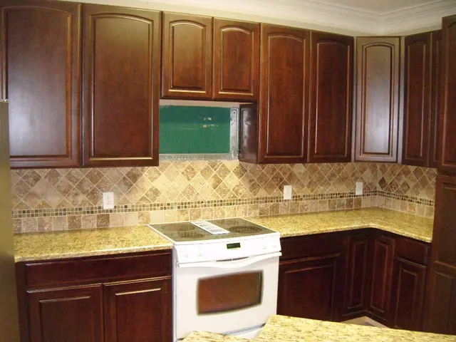 "Is it necessary to install flooring beneath kitchen cabinets? Expert opinion"