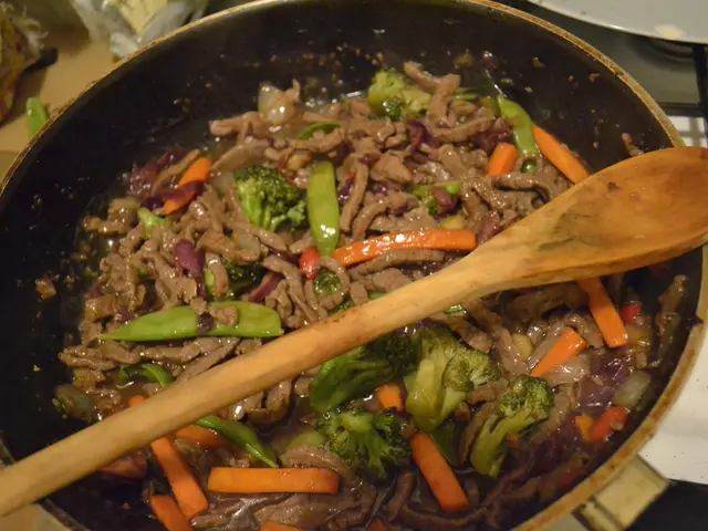 In this image there are slices of carrots, beans, broccoli and some other food items in a pan and...
